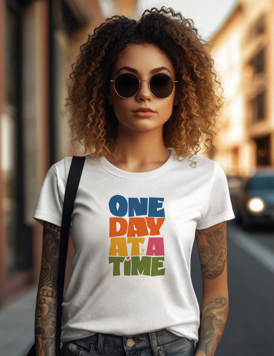 "One Day at a Time" with this beautifully designed women’s T-shirt.
